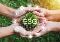 Hands adult Teamwork harmony Holding earth on hands with ESG icon concept for environmental, social, and governance in sustainable and ethical business on the Network connection