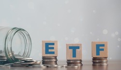 ETF (Exchange Traded Fund), business finance. Wooden cubes with the letters ETF arranged in a vertical pyramid. ETF - short for Exchange-Traded Fund, business concept.