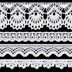 Set of white tape lace on a black background. The lace is crocheted by hand. Vintage style. Material for stylish graphic decoration.