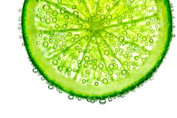 lime with bubbles in water isolated on white background