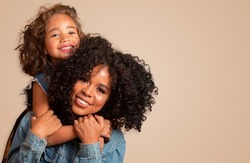 happy mother's day. Adorable sweet young afro american mother with cute little daughter.