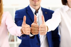 Group of people show OK or approval with thumb up during conference closeup. High level quality product, serious offer, excellent education, mediation solution, creative advisor participation concept
