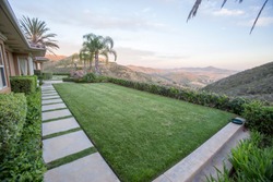 Home with lawn and view of hills in San Diego CA