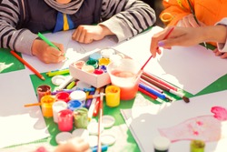 children draw with parents paint beautiful pictures, children's creativity