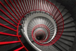 an abstract detail of a spiral staircase in an old building, abstract red and black wallpaper