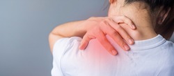 woman with her shoulder sprain, muscle painful during overwork. Girl having body problem after wake up. Shoulder ache, Scapular pain, office syndrome and ergonomic concept