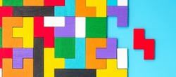 colorful wood puzzle pieces on blue background, geometric shape block. Concepts of logical thinking, Conundrum, solutions, rational, strategy, world logic day and Education