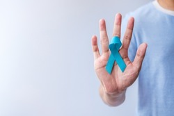 Blue November Prostate Cancer Awareness month, Man in blue shirt with Blue Ribbon for support people life and illness. Healthcare, International men, Father, Diabetes and World cancer day