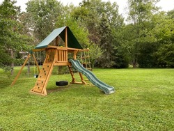 Wooden Swing Set Kids Slide Outdoor Backyard Playground Playset Clubhouse, rock climbing wall, swings with tire swing, an access ladder