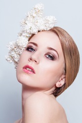 BEAUTY portrait of a girl with flowers in her hair. Girl with the white  lilac flowers. Fresh Clean Skin. 