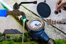 Water meter on concrete with home and green nature background, Measuring device, Open cover of water meter to check counter number of water consumption, water pipe and meter with waterspout of home