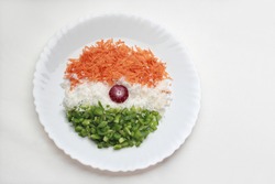 Cut vegetables arranged like Indian tricolour flag in a plate. Concept for Indian Independence Day