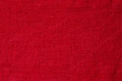 Red pure linen texture. Wrinkled linen fabric background. Light red natural linen texture background
