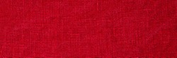 Linen fabric crumpled texture, copy space banner. Stone washed pure linen red background