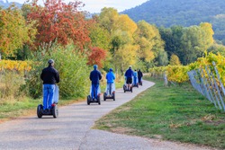 eco-friendly Segway scooters travel tour in Vineyards Palatinate region, Deutsche Weinstrasse, German Wine Road, Rhineland-Palatinate, Germany. 