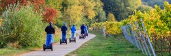 eco-friendly Segway scooters travel tour in Vineyards Palatinate region, German Wine Road, Rhineland-Palatinate, Germany, banner 