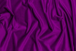 Violet Velvet cloth backdrop. Velvet violet color Fashion background. 2022 year colour trend. Purple violet soft fabric texture, copy space, text place. 