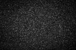 Noisy Black basalt gravel background. Dark sand texture. Lots of small stones. Dark quartz aquarium substrate. Garden pond gravel backdrop. Terrarium natural  fine-grained igneous lava rock