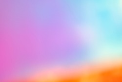 Blurred Holography abstract background in blue pink colors. Holographic pastel colour. Sunrise sky background. Abstract colorful blur for web design, colorful pastel background, blurred vivid