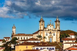 Old church on top of the hill and between the houses in the city of Ouro Preto in Minas Gerais, Brazil