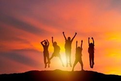 successful human and fighting spirit, Silhouette group young, people are delighted by show of hands higher. succeed. Business, successful, achievement, teamwork and goal concept.