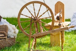 Spinning wheel for alpaca, angora and mohair wool spinning at a medieval market spectacle