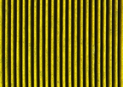 A surface of yellow clean corrugated car filter texture
