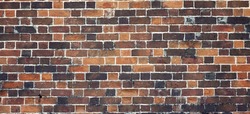 Red Brown Yellow Black Old Rustic Brick Wall Textured Background.  Retro Brickwall Wide Wallpaper. Abstract Architecture Web Banner