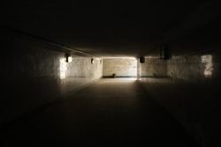 dark underpass and light at the end of the tunnel