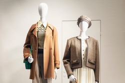 Male and female mannequins in a shop window. Stylish new collection for the autumn-winter season. 