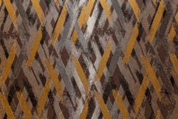 The surface of the textured wallpaper with a grey-brown graphic pettern. Modern trends in decor and interior design. Close-up.