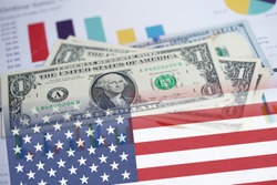 US dollar banknotes money on chart graph spreadsheet paper with USA America Flag. Financial , Banking Account, Statistics, Investment Analytic research data economy, trading, Business.