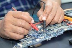 Technician repairing inside of mobile phone. Integrated Circuit. the concept of data, hardware, technology.