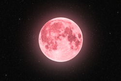 Pink full super moon glowing with pink halo surrounded by stars on black sky background