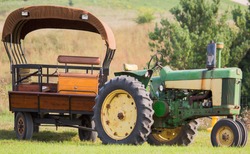 Old tractor with covered wagon