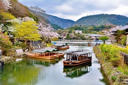 Boats on the river in Arashiyama Park, Kyoto, Japan