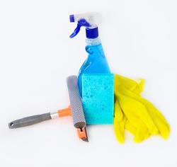 window cleaning products: squeegee, sponge, window cleaning liquid, gloves on a white background. Cleaning service. Tools for washing, cleaning. Copy space