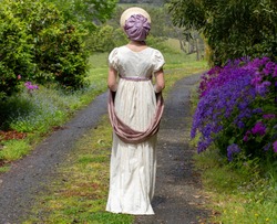 Regency woman in cream dress