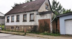 Old and ugly dilapidated city house in Denmark