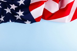 American flag lies on top of a blue background