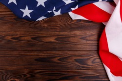 American flag on the right and top side on a wooden background