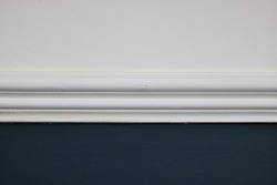 Victorian design feature - dado rail painted white on white and dark teal wall