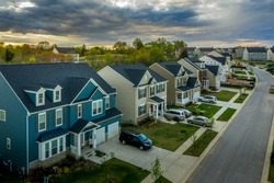 Aerial view of typical American new construction neighborhood street in Maryland for the upper middle class, single family homes USA real estate