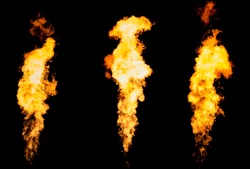 Set of three isolated fire pillars. Flame tongue goes from gas burner.