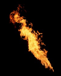 Long narrow flame isolated on black, fire stream