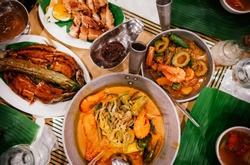 Meal set of various traditional Filippino Food,  Pakbet, lechon kawali, Bale Dutung. Top view
