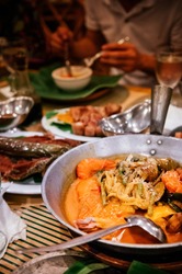 Meal set of various traditional Filippino Food,  Pakbet, lechon kawali, Bale Dutung. Top view