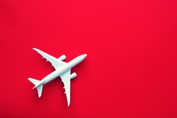airplane toy model on red background
