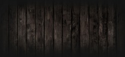 Black wood texture background coming from natural tree. The wooden panel has a beautiful dark pattern, hardwood floor texture