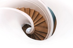 Indoor modern spiral staircase in white. Top view.